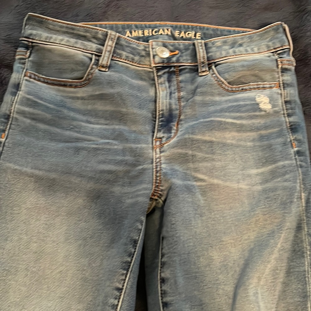 Med/light denim distressed skinny jeans, super soft; size 8